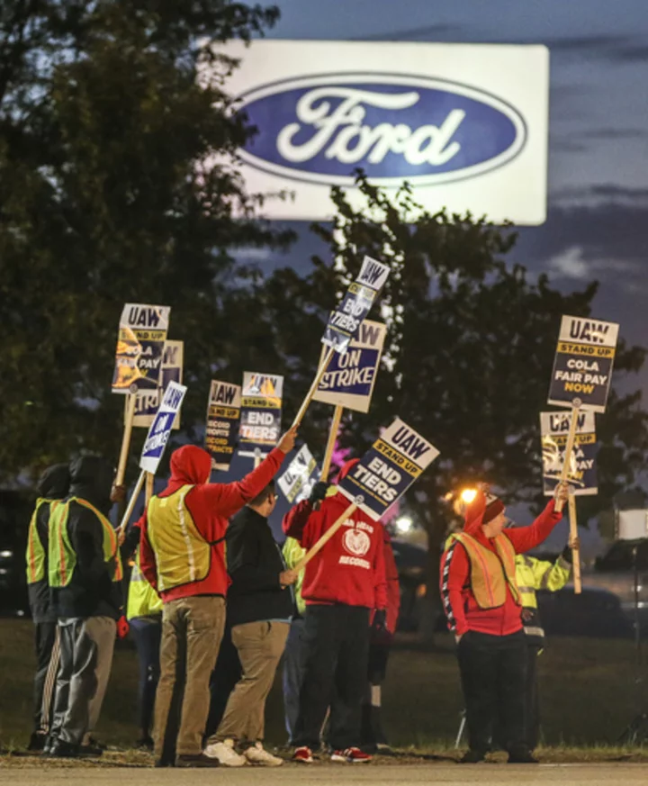 Auto workers escalate strike, walking out at Ford's largest factory and threatening Stellantis