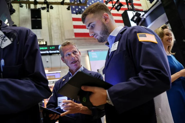 Wall Street futures slip as Fed minutes loom