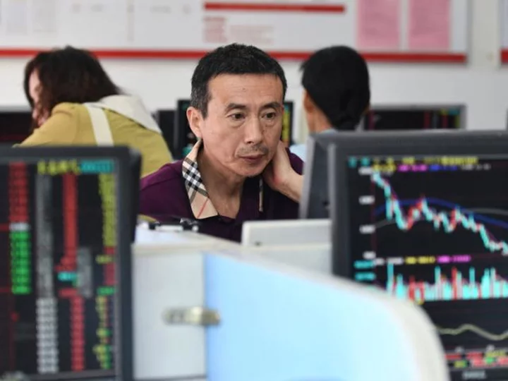 Chinese stocks get brief uplift from first share dealing tax cut since 2008
