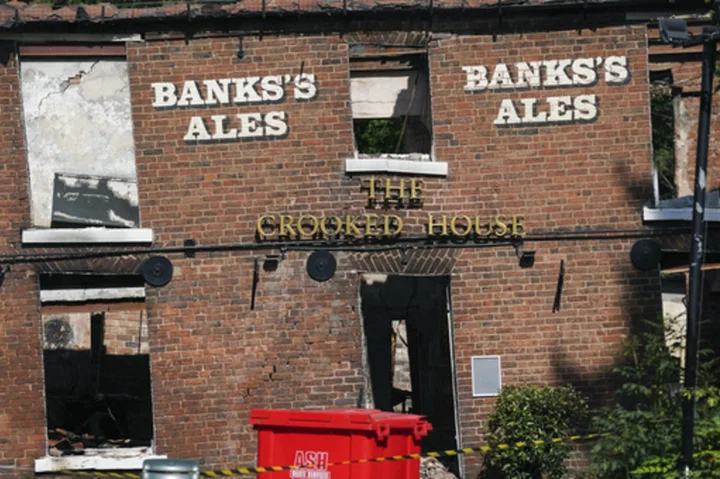 Angry villagers in England call for the quirky Crooked House pub to be rebuilt following demolition