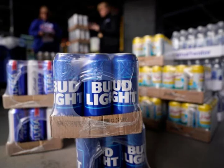 Anheuser-Busch is writing checks to distributors as Bud Light sales sink