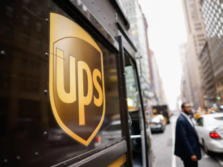 UPS says its profit will fall after it reaches a Teamsters deal. Its stock is sinking sharply
