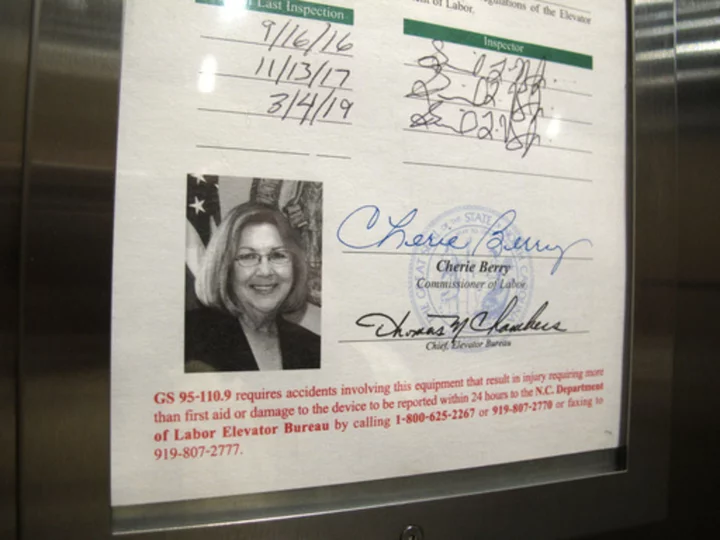 North Carolina's top elevator official says he'll no longer include his portrait in every lift