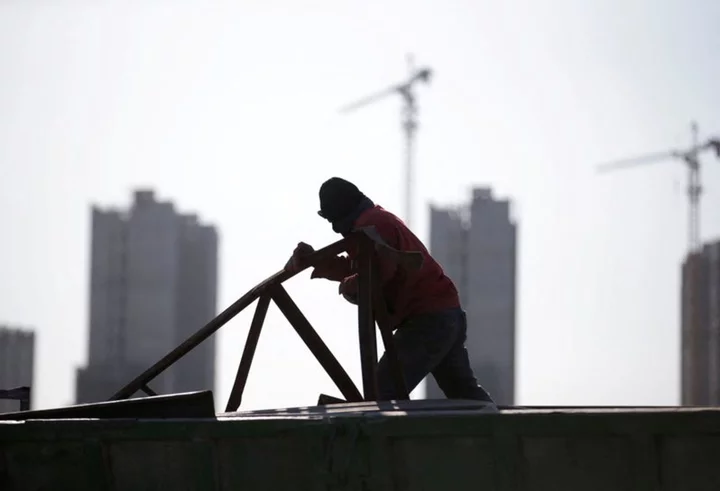 China new home prices inch up for third month in November - survey