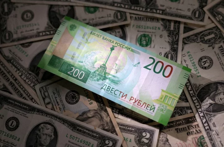 Instant view: Russia's rouble weakens past 100 per U.S. dollar
