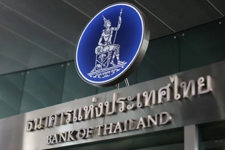 Thai central bank holds key rate steady, trims growth outlook