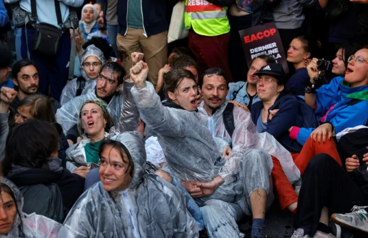 French oil giant defends strategy after police teargas climate protesters