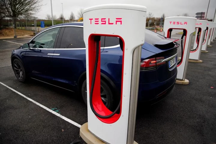Tesla shares jump on EV charging tie-up with GM