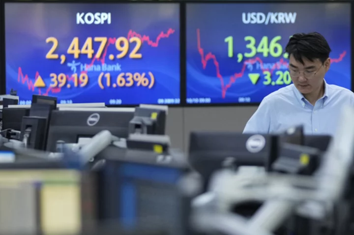 Stock market today: Rate hopes push Asian shares higher while oil prices edge lower