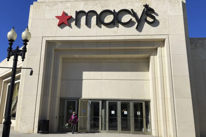 Macy's swings to loss and posts sales decline in 2Q but adjusted results beat Wall Street views