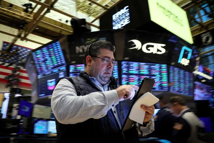 Wall Street opens higher as Treasury yields retreat; earnings in focus