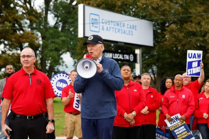 Biden says UAW should get a 40% raise as he joins picket line