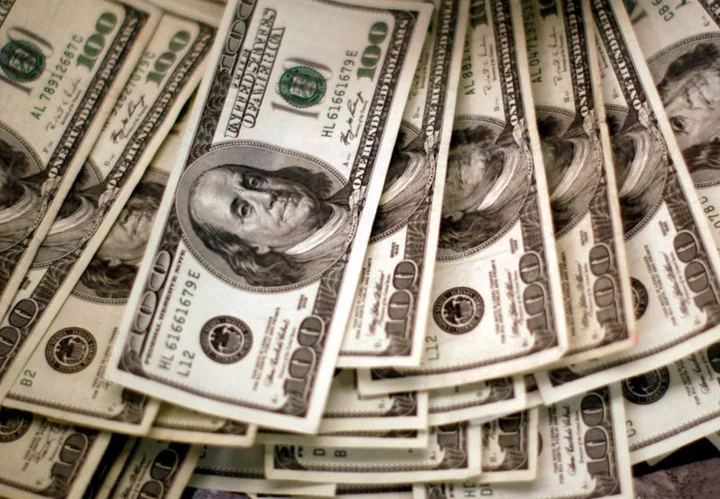 Dollar teeters near one-year low; euro climbs to 17-month peak