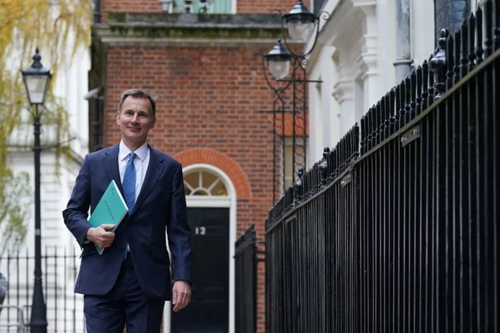 With eye on election, UK's Hunt cuts taxes in bid to boost economy