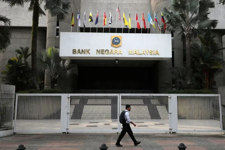 Malaysia's central bank hits pause on rates as price pressures ease