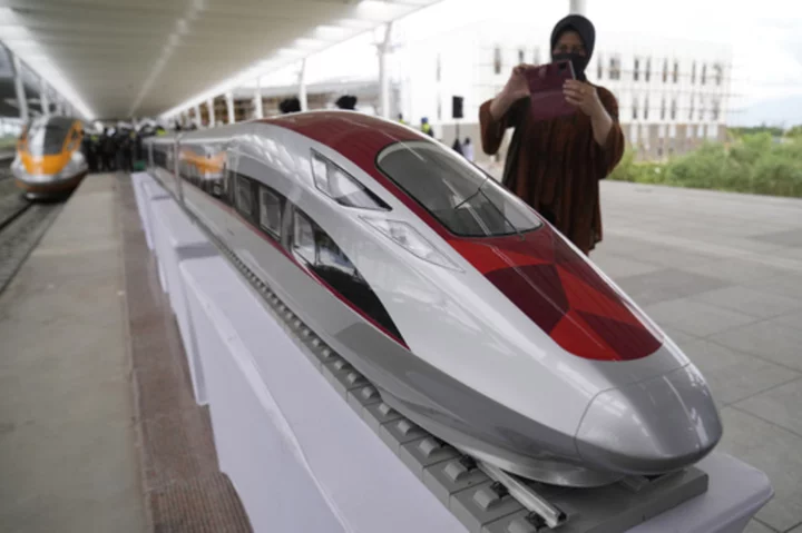 Chinese Premier Li Qianq takes a test ride on Indonesia's new high-speed railway