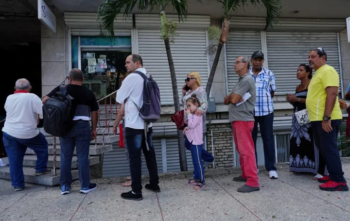 Cubans struggle as peso loses half its value in a year on informal market