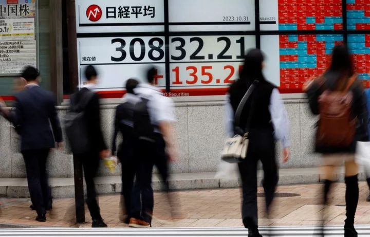Asian stocks subdued as traders brace for inflation data