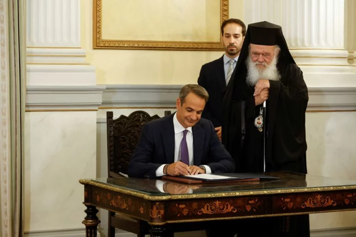 Mitsotakis sworn in as Greek PM, promises more jobs and 'big changes'