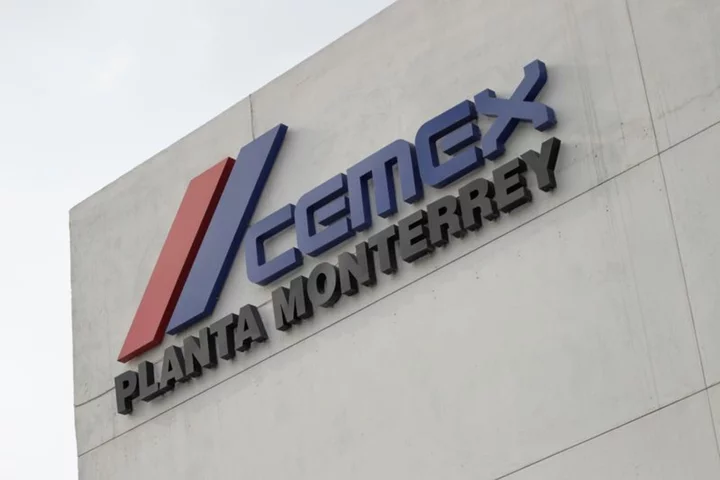 Mexico's Cemex sees slight profit on price hikes, strong peso