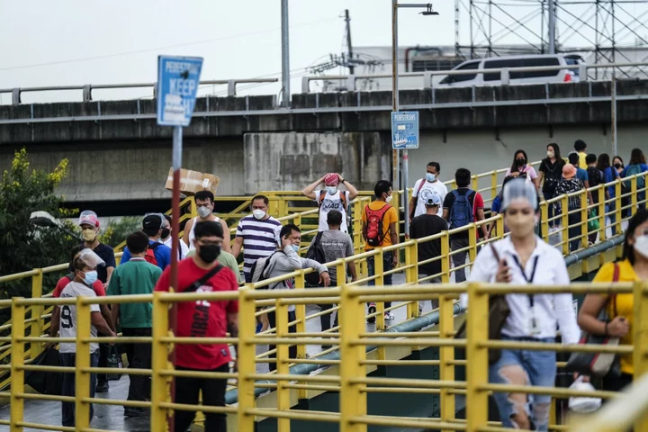 Manila to Suspend Work, School July 24 on Typhoon and Strike