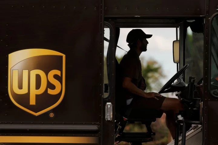 UPS cuts revenue view on lower e-commerce demand, new labor contract