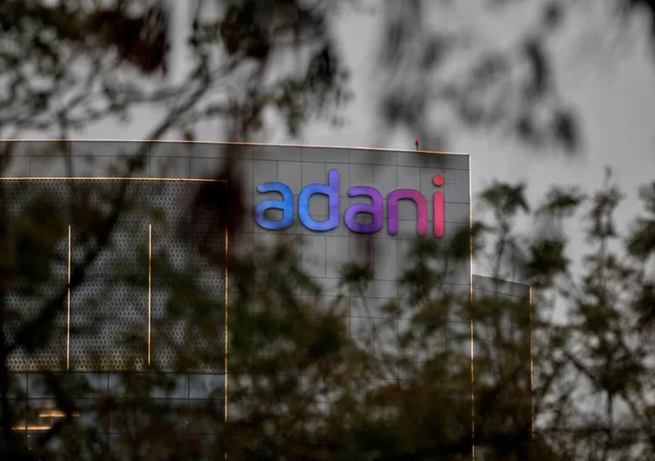 Business partners of India's Adani family used 'opaque' funds to invest in its stocks, media group says