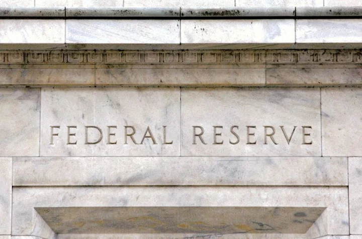 Fed seen keeping rates on hold well into next year
