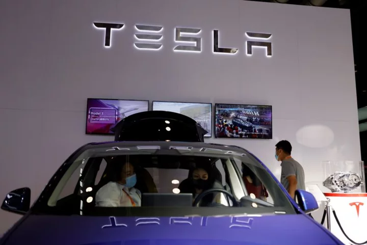 Tesla offers new China rebate as price cuts rock EV market