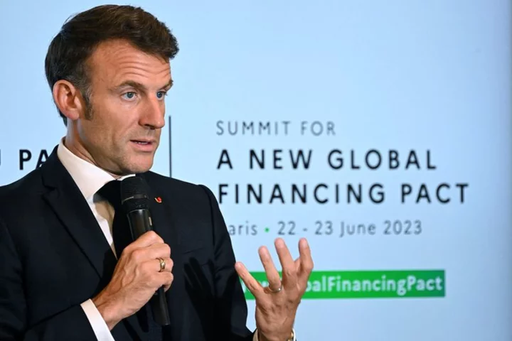 Rich nations finalise $100 billion climate aid at Paris summit - Macron