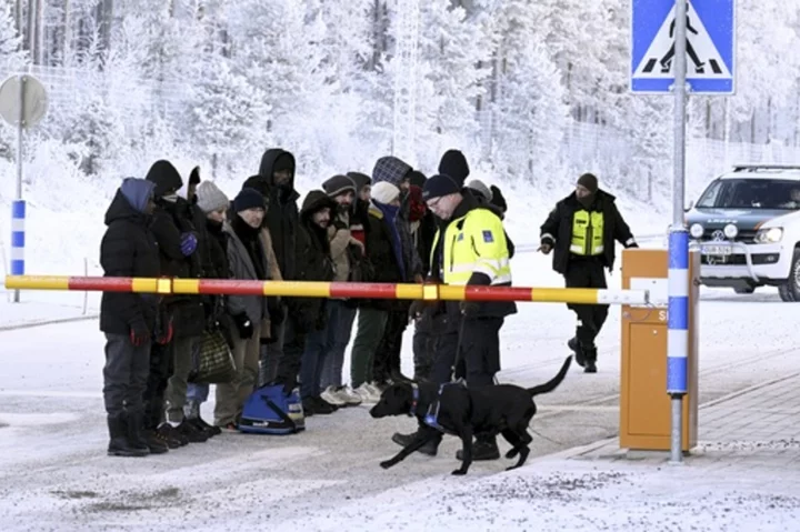 Finland erects barriers at border with Russia to control influx of migrants. The Kremlin objects