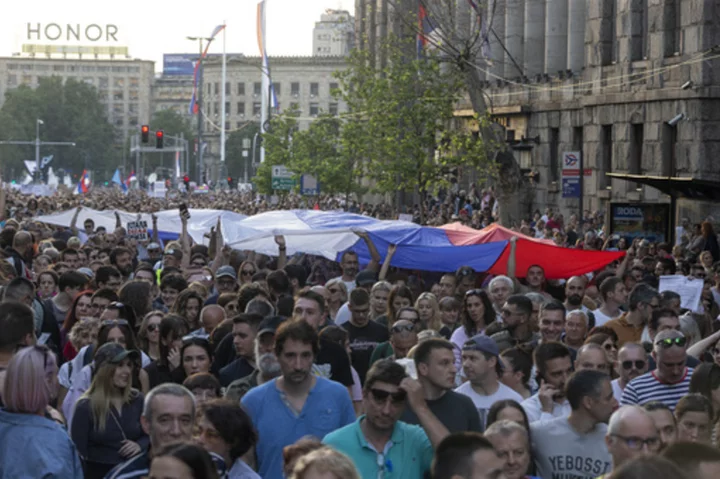 Serbia's president promises early election amid large protests against his populist rule