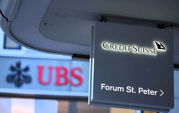 Factbox-Key figures for UBS, including Credit Suisse