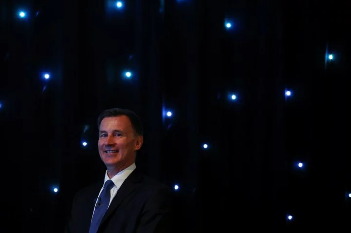 UK finance minister Hunt says banks are slow to pass on rate hikes to savers
