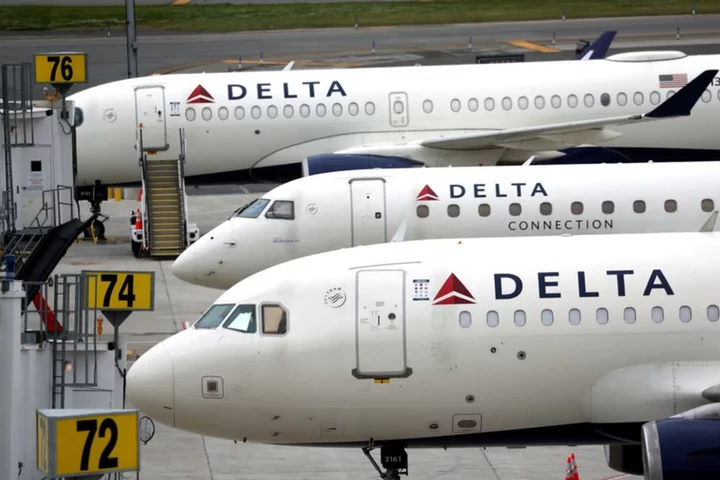 Delta lays off some corporate workers to cut costs
