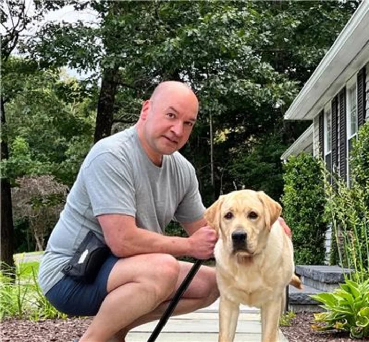 UConn Huskies football game on Sept. 23 will include on-field recognition of Voya Financial leader, and his service dog in-training, for commitment to Connecticut