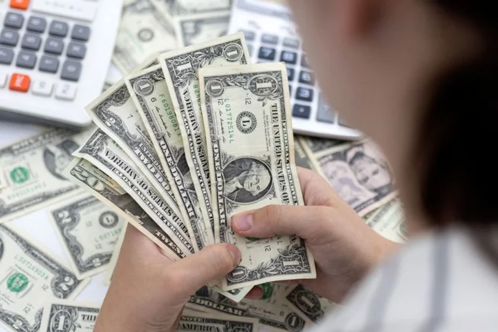 Dollar hits new high on upbeat data, yen teeters near 150