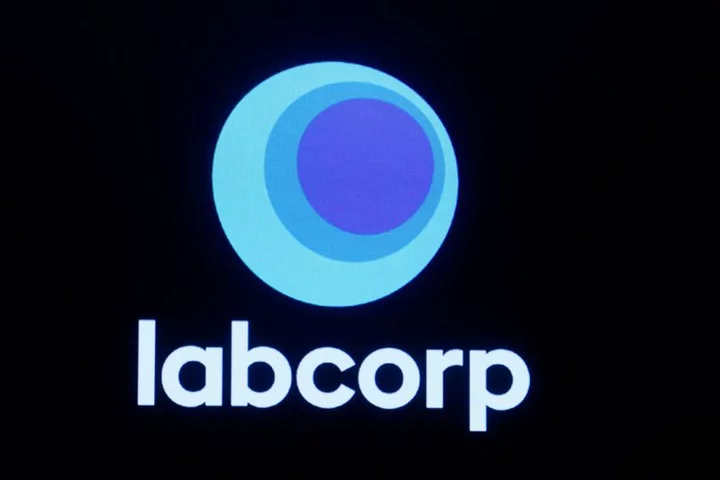 Labcorp cuts 2023 profit forecast on drug development woes