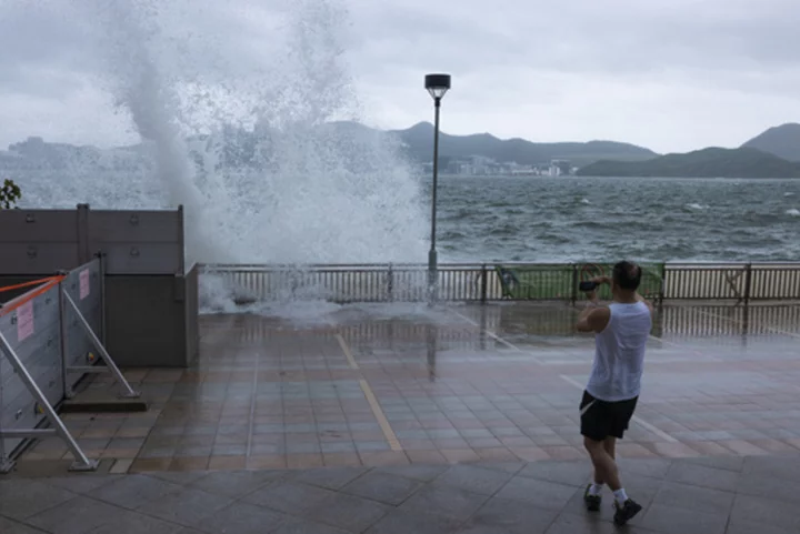 Schools and stock market are closed as Typhoon Talim sweeps south of Hong Kong