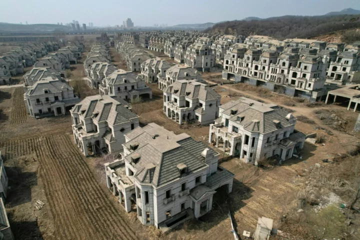 Chinese ghost town of mansions reclaimed by farmers