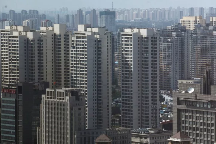 More Chinese cities lift home-buying curbs to revive demand