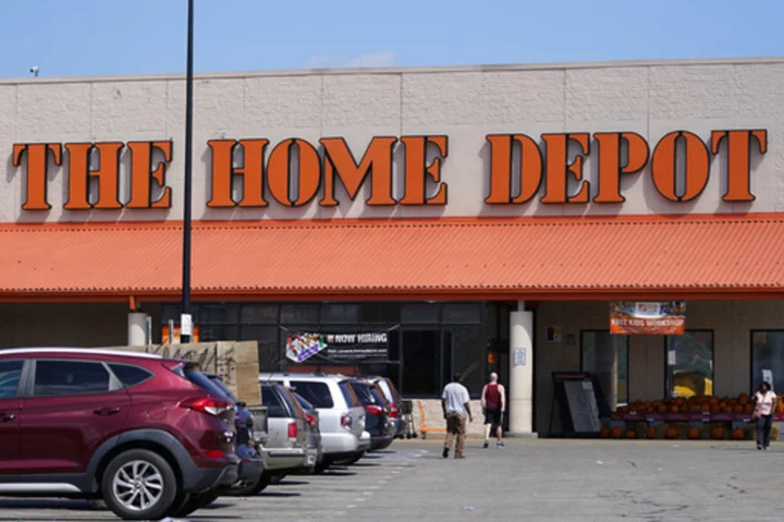 Home Depot, after years of explosive growth, cuts its outlook as Americans cool spending on homes