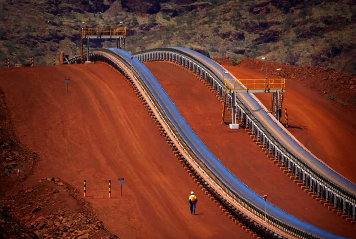 Fortescue profit drops on Iron Bridge impairment charge; co-CEO to step down