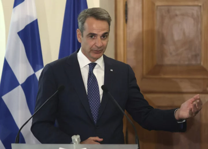 Greek prime minister seeks improved relations with Turkey but says Ankara needs to drop aggression