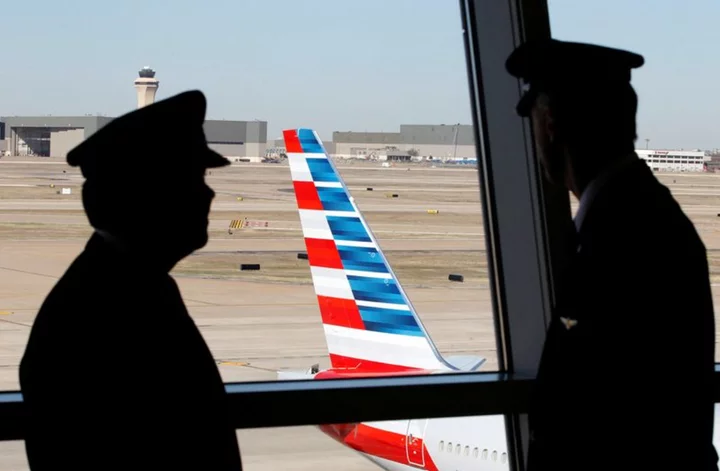 American Airlines pilots to get 21% pay raise this year in tentative contract -sources