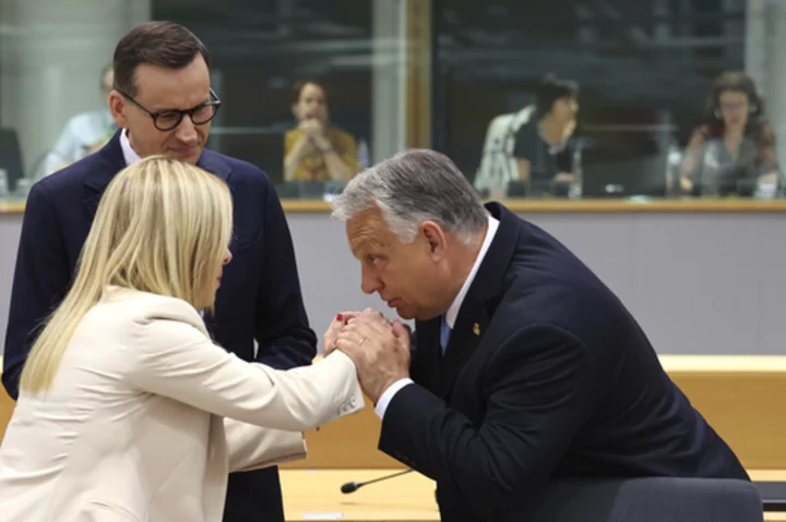 EU leaders pause talks as Poland and Hungary's anti-migrant governments block progress